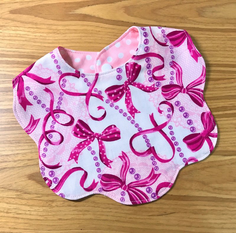 Pink bow on both sides with flowers bibs