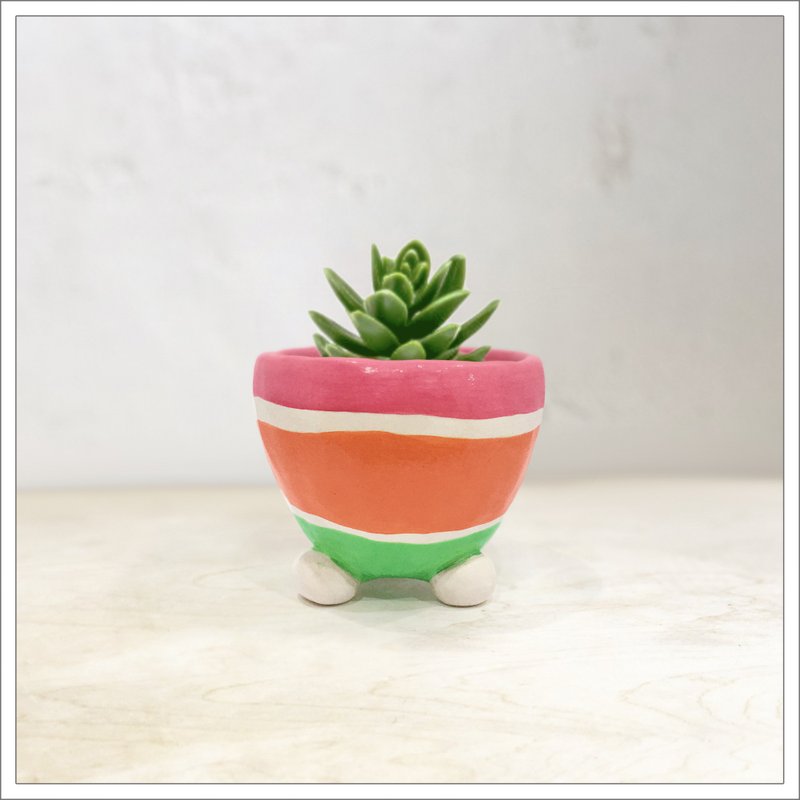 Hand pinched and painted ceramic pot in pink, orange and green straps