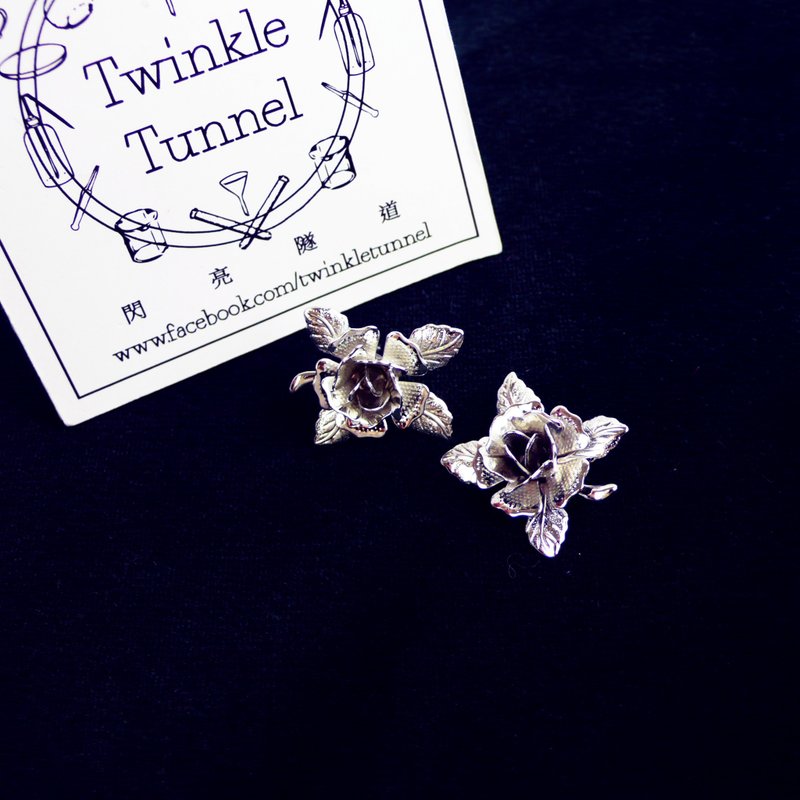 Silver rose earrings ear