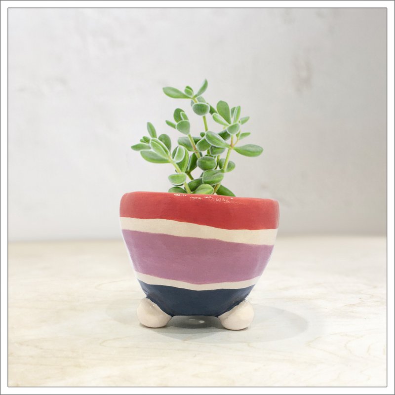 Hand pinched and painted ceramic pot in coral, lilac and indigo straps