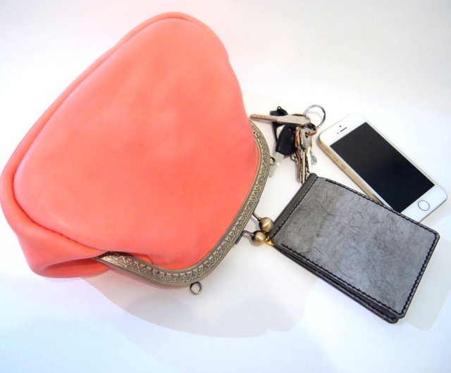 pink and orange clutch bag