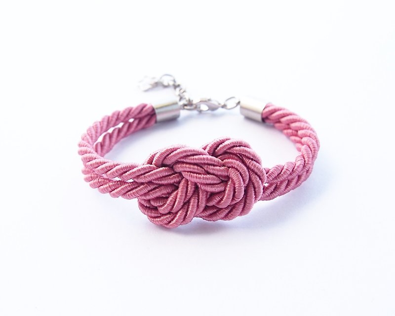 Coral pink infinity knot bracelet - สร้อยข้อมือ - วัสดุอื่นๆ สึชมพู