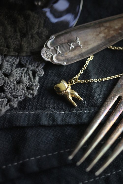 defy A Tooth (two fangs) Charm Necklace by Defy.
