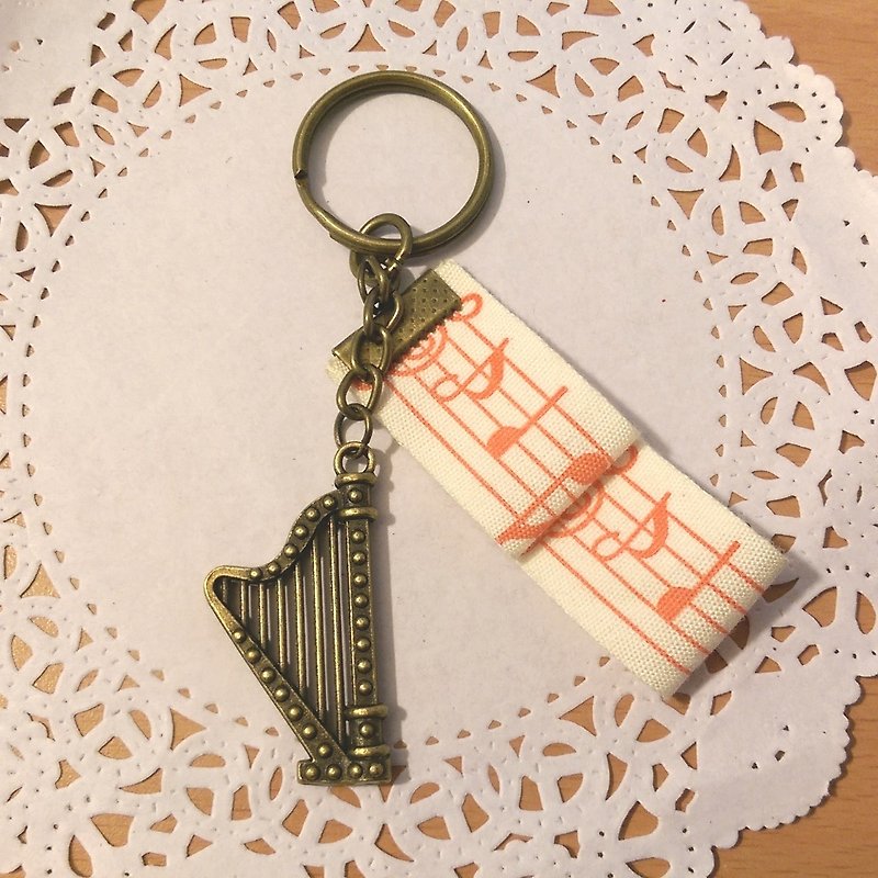 【Harp Ribbon Key Ring (Bronze)】 Musical Instrument Speakers Ribbon Hand-made Customized "Rice Bear" Graduation Gifts - Keychains - Other Materials Khaki