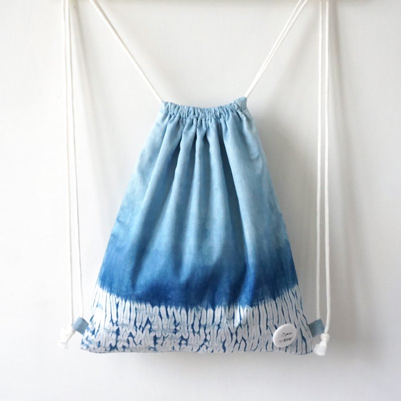 S.A x Straw, Indigo dyed Handmade Abstract Pattern Backpack - กระเป๋าหูรูด - ผ้าฝ้าย/ผ้าลินิน สีน้ำเงิน