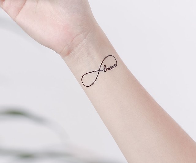 Be brave lettering tattoo on the wrist