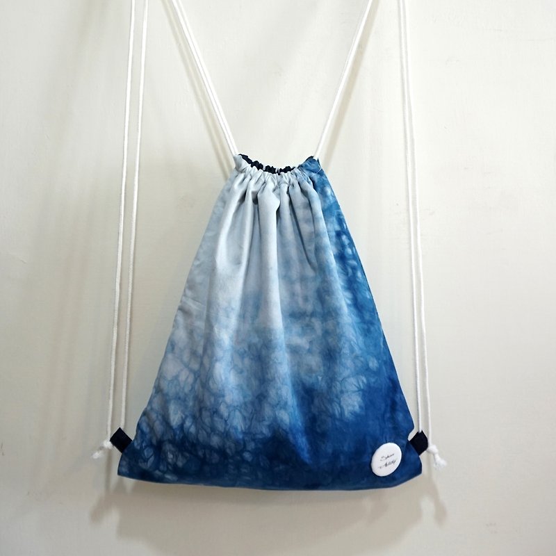 S.A x Sparkle, Indigo dyed Handmade Natural Pattern Backpack - กระเป๋าหูรูด - ผ้าฝ้าย/ผ้าลินิน สีน้ำเงิน