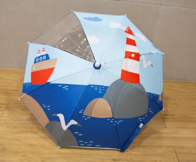 ユニークな形と遊び心のある持ち手が特徴の子供用傘 - ショップ