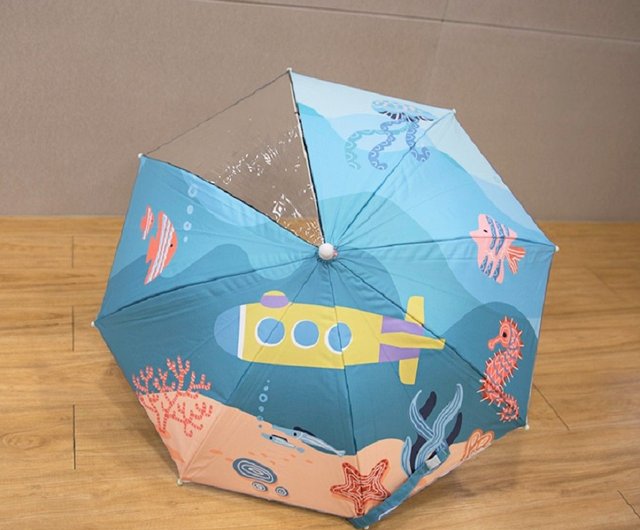 ユニークな形と遊び心のある持ち手が特徴の子供用傘 - ショップ