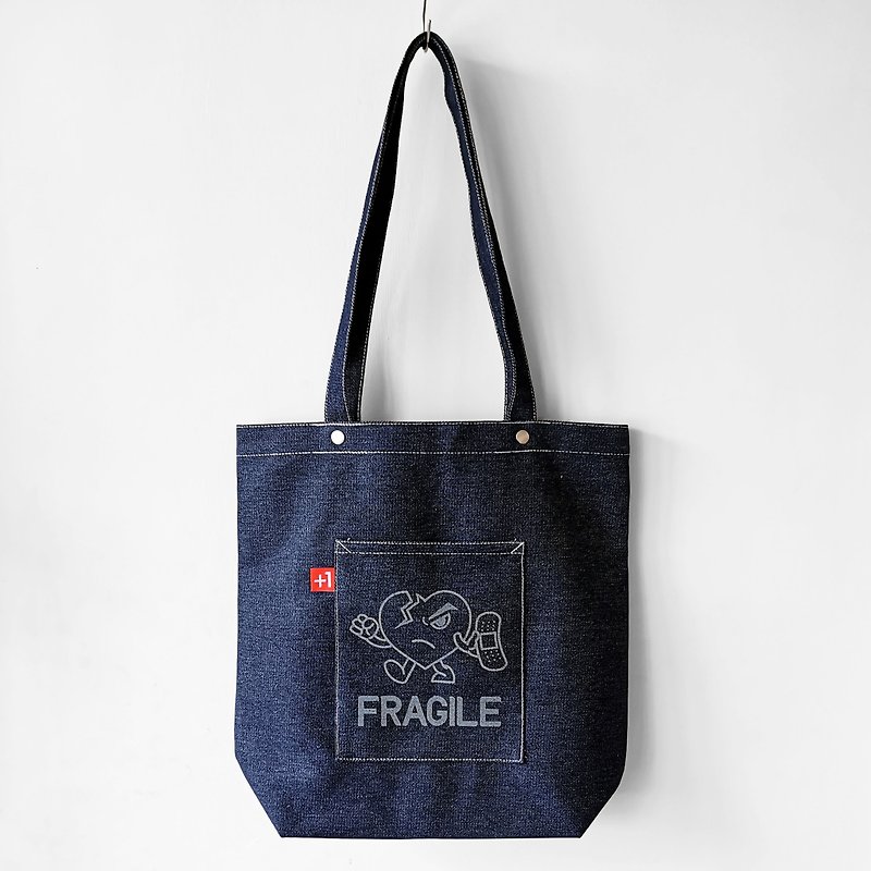 Plus 1 x CHI Fragile Heart CUBE Indigo Denim Tote Bag - กระเป๋าถือ - ผ้าฝ้าย/ผ้าลินิน สีน้ำเงิน
