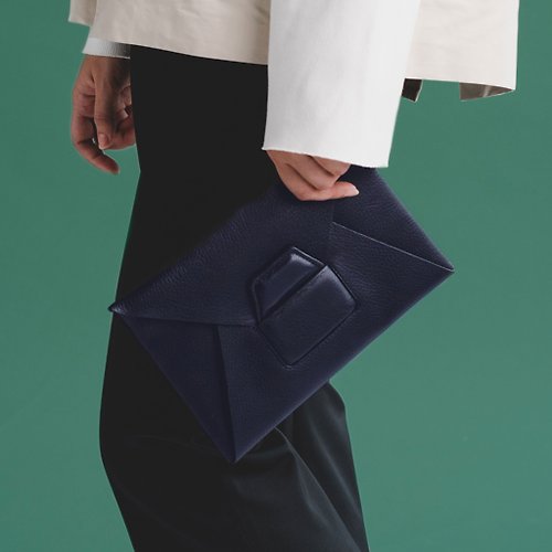 THEOREM GEO4 Clutch A plain leather clutch bag, the size of an iPad mini.