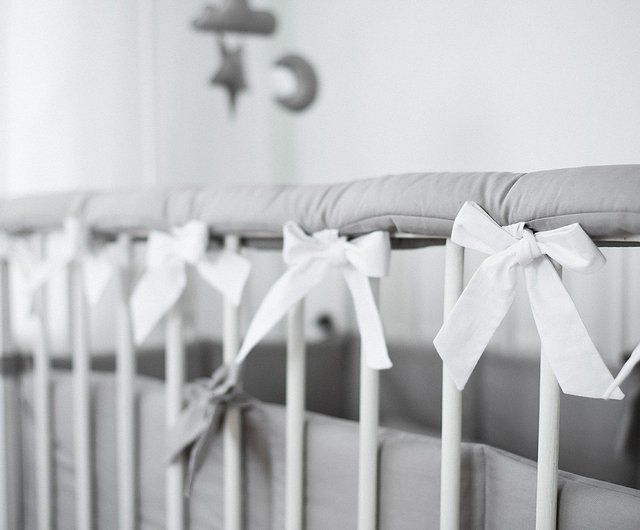 Gray crib clearance rail cover