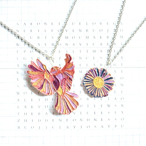 clay-to-say Faith in Me - A flying bird with Aster flower polymer clay necklace