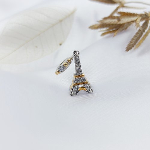 Asharichplus Eiffel Tower silver charm in gold decorated with white crystal for bracelets.
