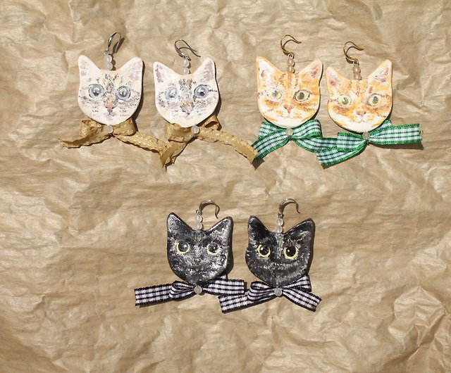 蝶ネクタイの手作りイヤリングを持つ猫 ショップ ハッハッハッ ピアス・イヤリング Pinkoi