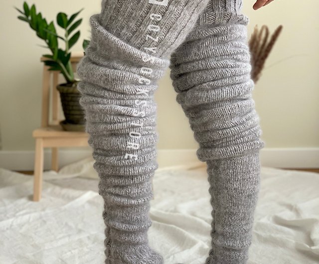 High socks or chubby knit leggings with fur pom pom.