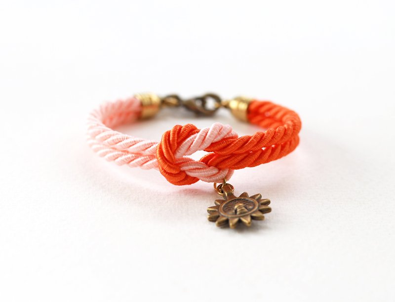Peach / Sunburst knot rope bracelet with sun charm - Bracelets - Other Materials Orange