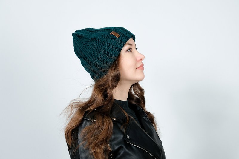 Green handmade wool hat. Twisted hat for women. Winter woolen knitted hat.