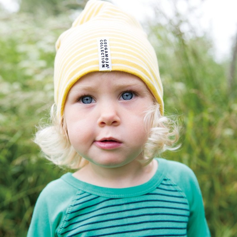 【北欧子供服】スウェーデン製オーガニックコットンの2歳から6歳までの子供用帽子イエロー/ホワイトのストライプ - 帽子・ヘアバンド - コットン・麻 イエロー