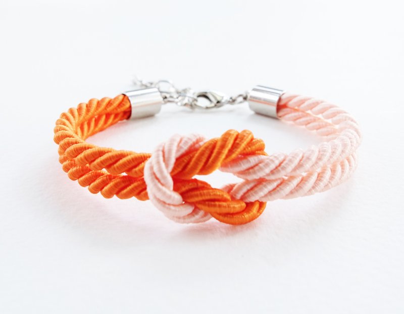 Orange/peach knot bracelet - สร้อยข้อมือ - วัสดุอื่นๆ สีส้ม