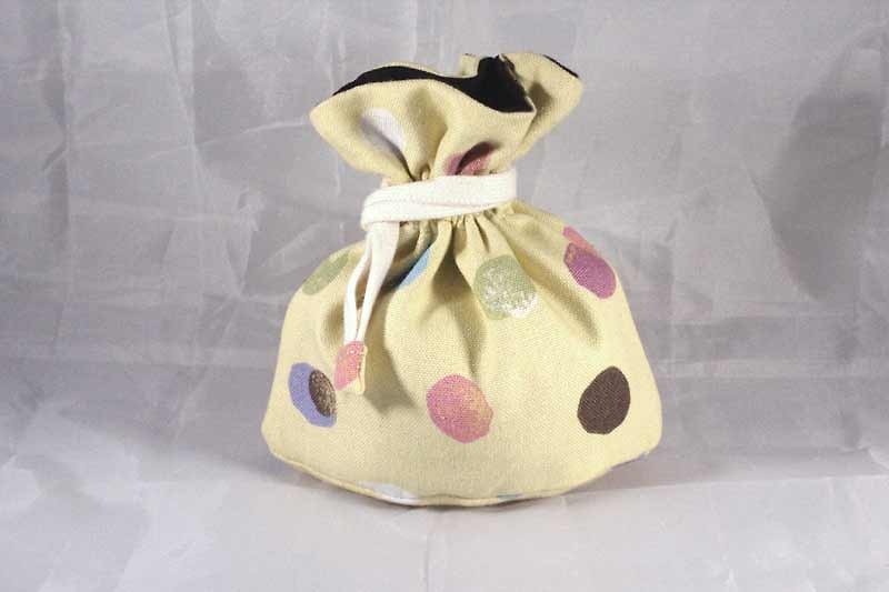 There are mini tote bag bottom - little yellow color - Toiletry Bags & Pouches - Other Materials Yellow