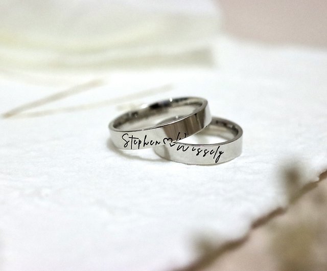 couple rings with engraved names