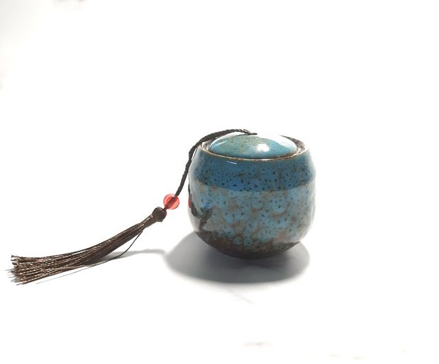 Small clay pot with a lid