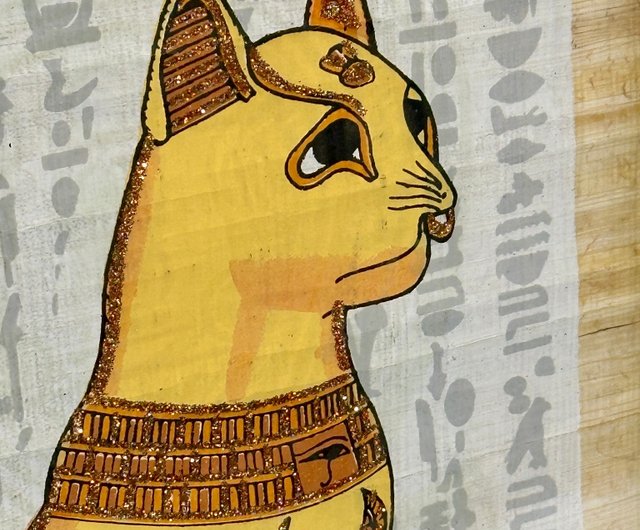白い背景に金色のフレームを持つエジプトの猫神のエジプトの