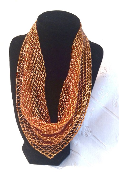 KadabrraBeadsJewelry A top-down braiding of a scarf from beads