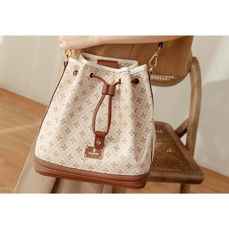 PLAYBOY - Bucket Bag Oat Milk Bunny Series - With Mini Bunny Bucket Bag Charm - กระเป๋าหูรูด - วัสดุอื่นๆ สีกากี