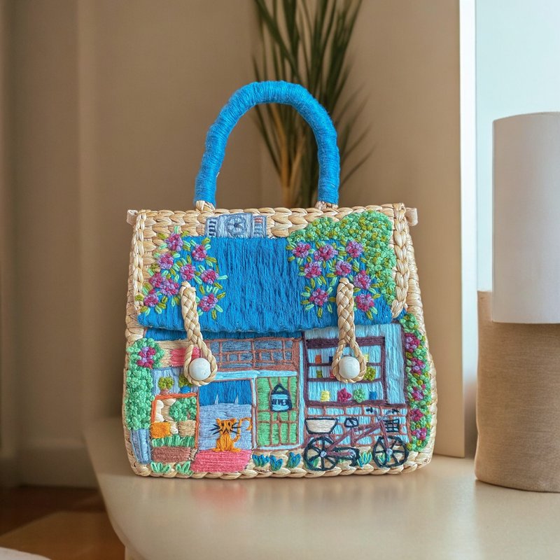 Water hyacinth bag with hand-embroidered vintage blue-roofed shop design - Handbags & Totes - Thread 