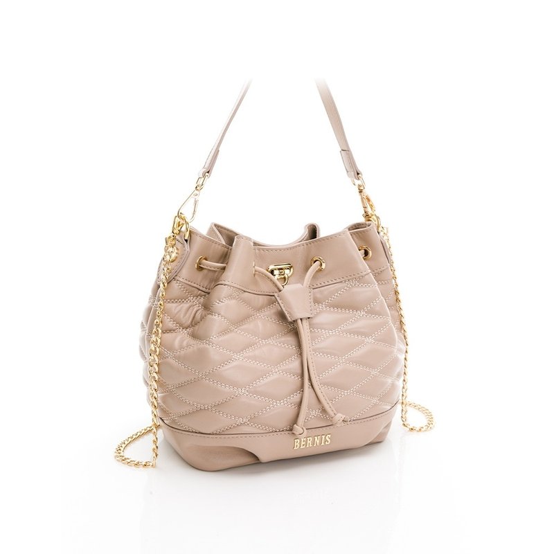 Diagonal back sheepskin series diamond Embroidery thread bucket bag three-dimensional cut cream color - กระเป๋าหูรูด - หนังแท้ สีกากี