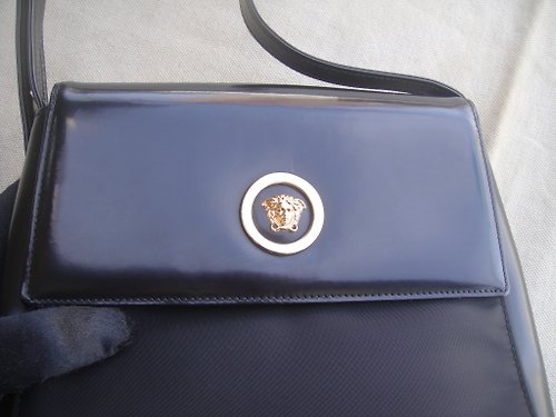 Versace Gianni Vintage Ostrich Skin Effect Mini Backpack, $1,597, farfetch.com