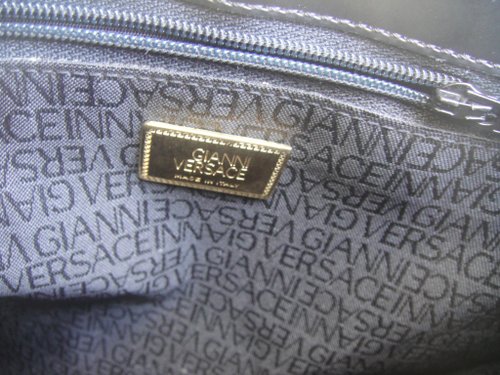 Do vintage versace discount bags have serial numbers