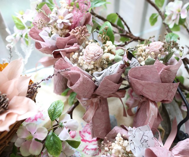 Dried pink flowers in paper