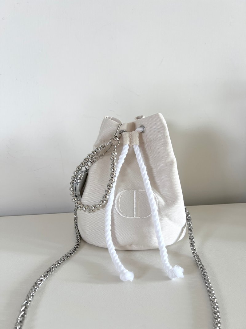 Unused Dior CD beige bucket chain bag comes with shoulder strap and Silver chain heart-shaped mirror charm. - กระเป๋าหูรูด - วัสดุอื่นๆ ขาว