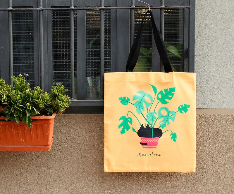 Canvas tote bag - Meowstera, a chubby black cat sitting on a monstera plant - Handbags & Totes - Cotton & Hemp Yellow