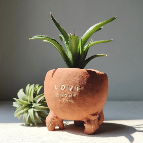 Noonster clay village Love grows here planter. Handmade plant pot