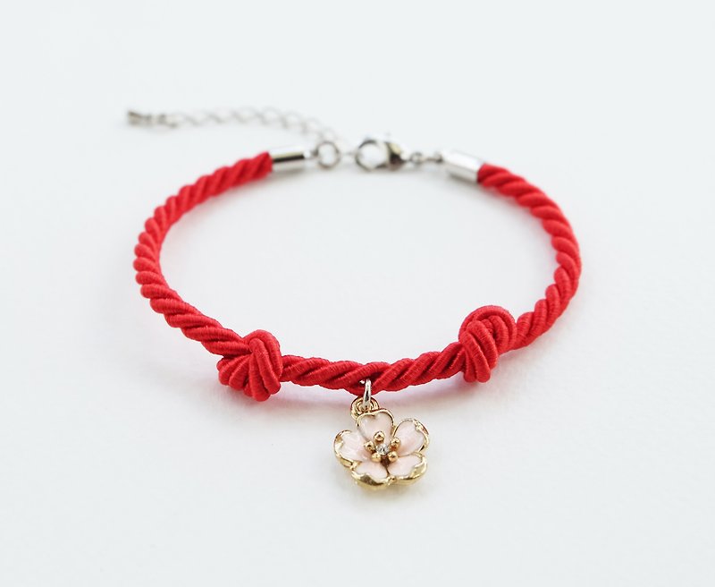 Red knot rope bracelet with sakura charm - สร้อยข้อมือ - วัสดุอื่นๆ สีแดง