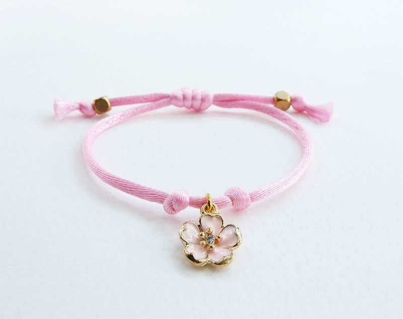 Pink silk rope bracelet with sakura pink charm - สร้อยข้อมือ - วัสดุอื่นๆ สึชมพู