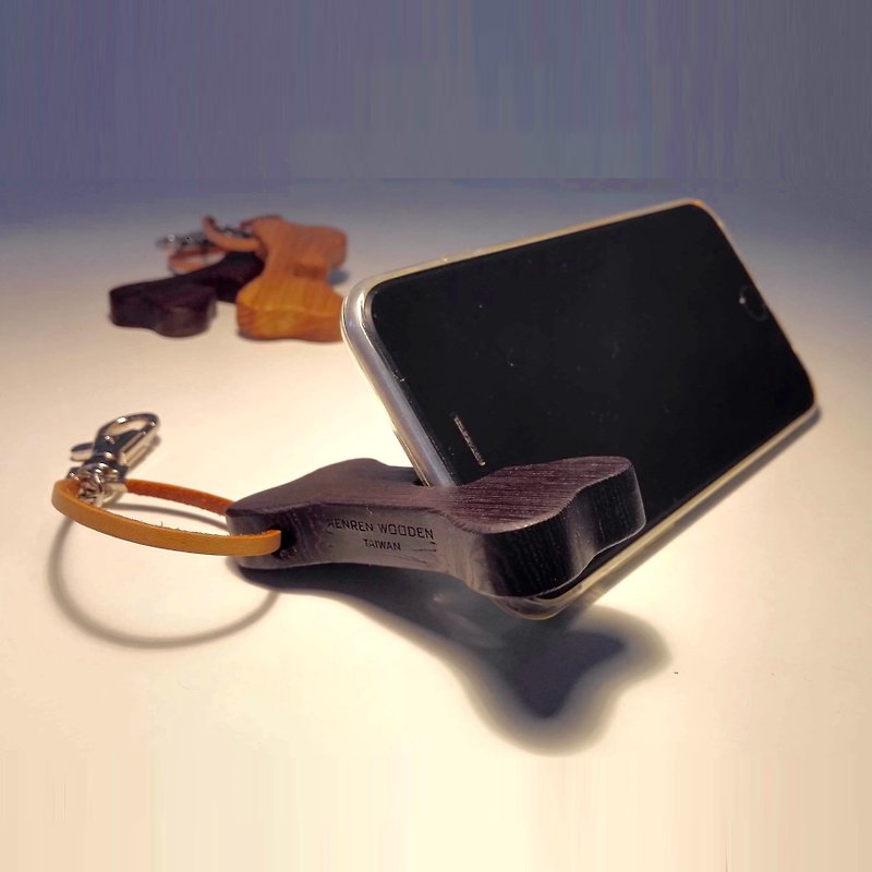 The bone shape of the mobile phone holder encourages you to carry the angle adjustable black chicken wing wood - Phone Stands & Dust Plugs - Wood Black