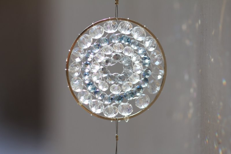 A shining clear gray mandala made of glass beads. - Other - Glass Blue