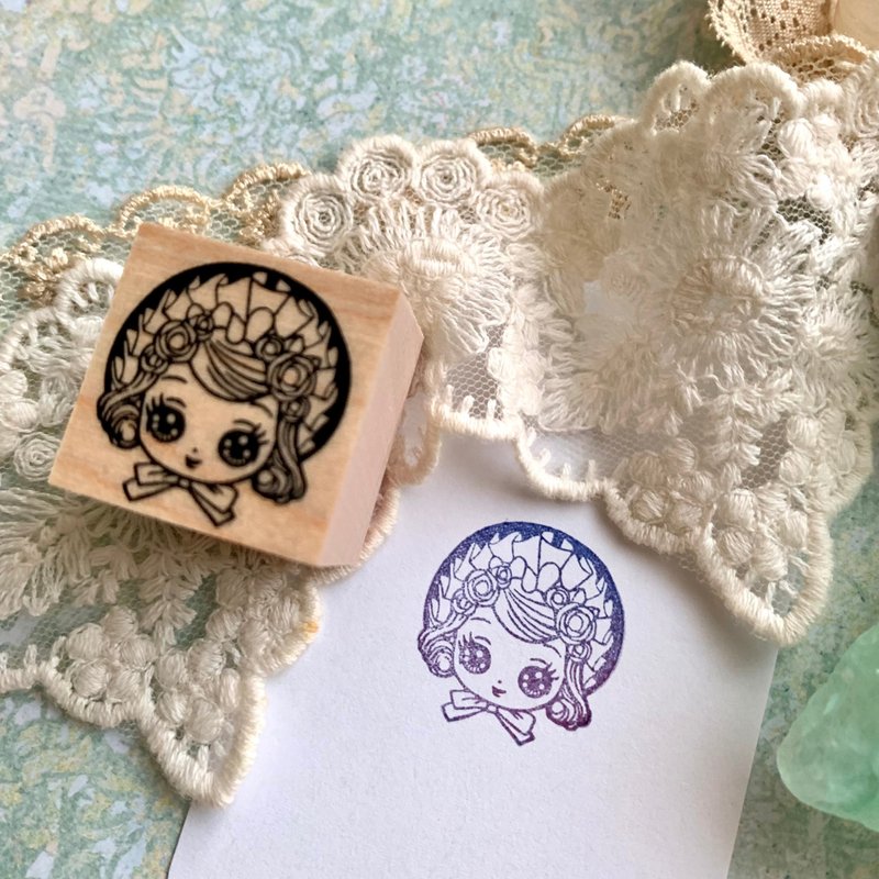 A rubber stamp of a girl wearing a small bonnet in the style of a cultural doll. - Stamps & Stamp Pads - Rubber 