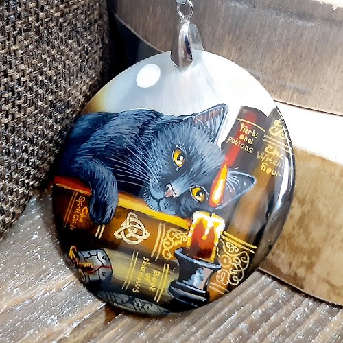 Charm.arts Mysterious black cat on pearl pendant. Dainty handmade jewelry on lacquer shell