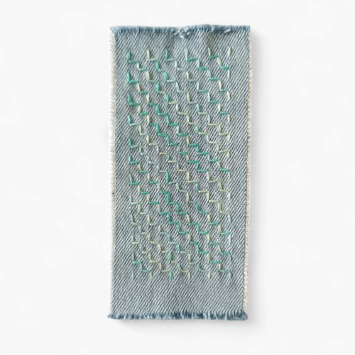OUMsk Sashiko patch hand sewn from recycled denim.