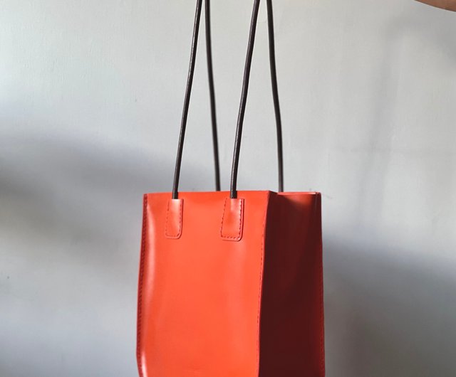 orange color handbags