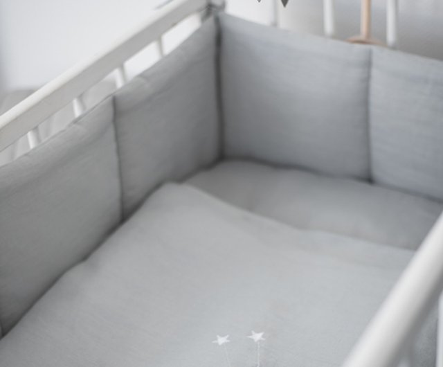 Grey and white store cot bumper