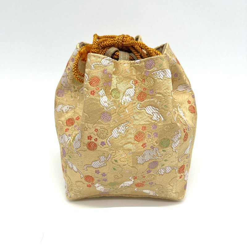 A fashionable drawstring bag with a Japanese pattern made from Kyoto Nishijin-ori fabric. - Other - Polyester Multicolor