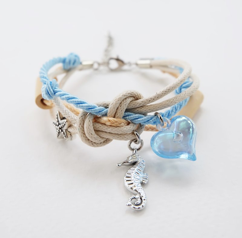 Ocean breeze bracelet with seahorse starfish wooden beads and heart charm - Bracelets - Other Materials Blue