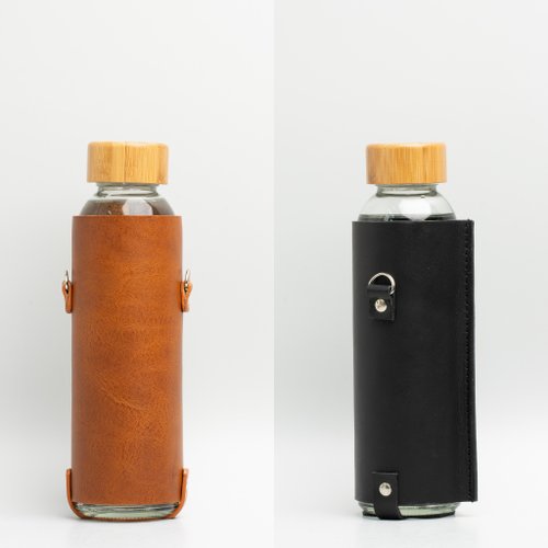 Leather water bottle holder with strap and glass bottle